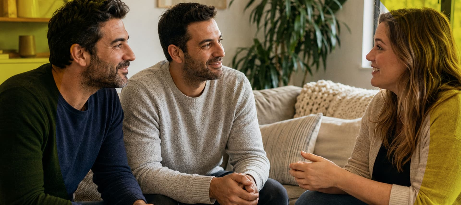 Intended fathers in a warm living-room conversation with their surrogate – cultural gaps becoming closeness